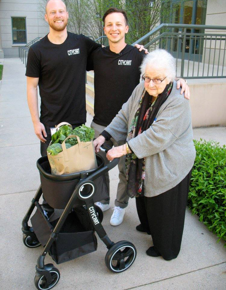 Photo of Eric Renard, Brandon Lopez and June Fisher with a CityCart prototype
